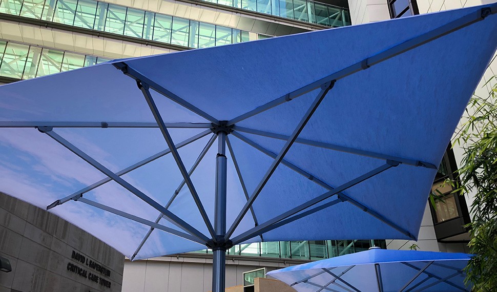 For people resting at the tables in the Healing Gardens, artist John Baldessari’s umbrellas provide cool, relaxing shelter.