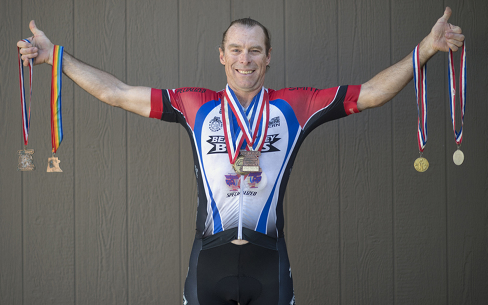 Scott McCosh holding his medals