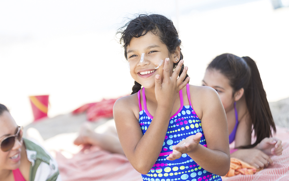 avoiding skin cancer, wearing a hat, sun screen