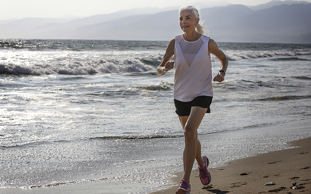 Bobbie Poledouris running on the beach.