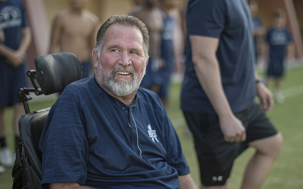 Coach Lance McCullah on the field.