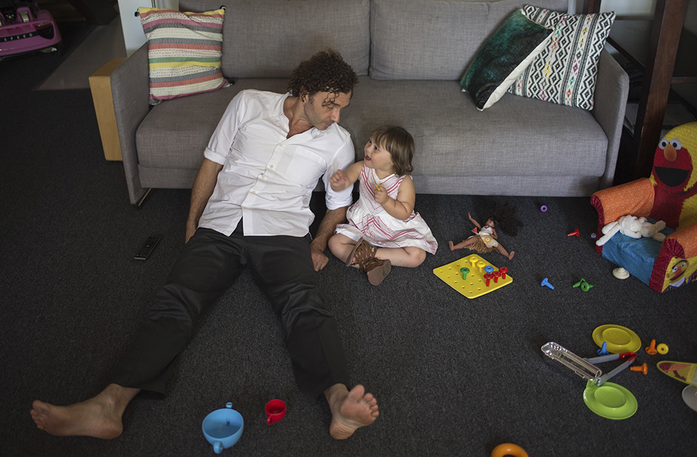 Aine and her father, Will, relaxing and playing at home.