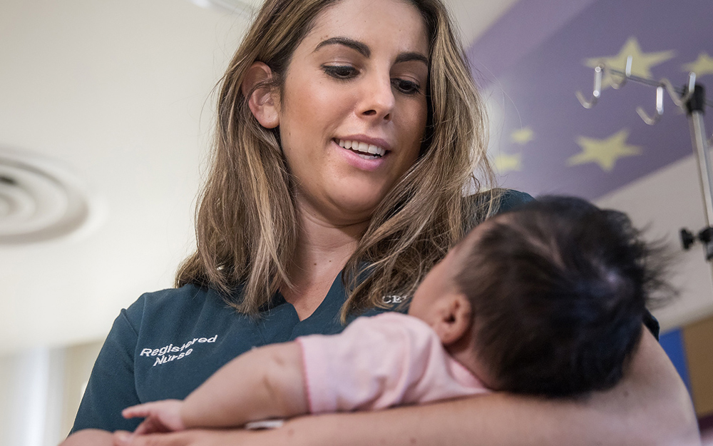 Registered nurse Chiara Casas with a Cedars-Sinai pediatric patient