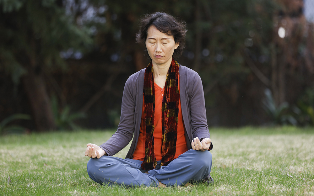 Stroke survivor Wenping Kuo meditating.