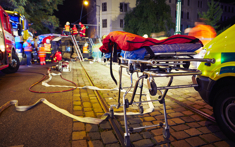 A car accident on the side of the road at night.