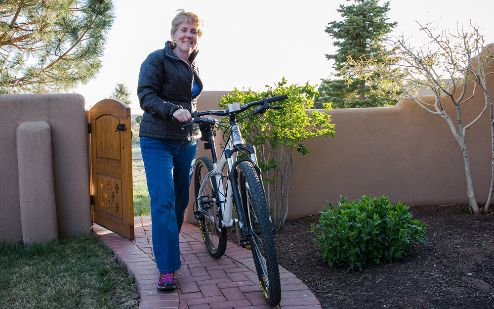 Beth Johnson returning home after riding her bike.