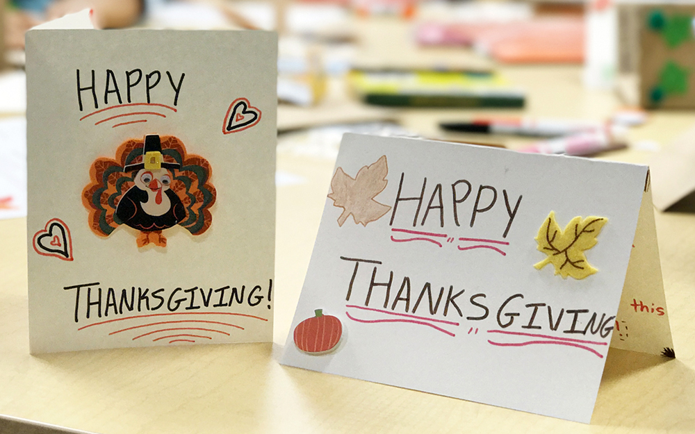 Teen volunteers creating Thanksgiving and holiday cards at Cedars-Sinai