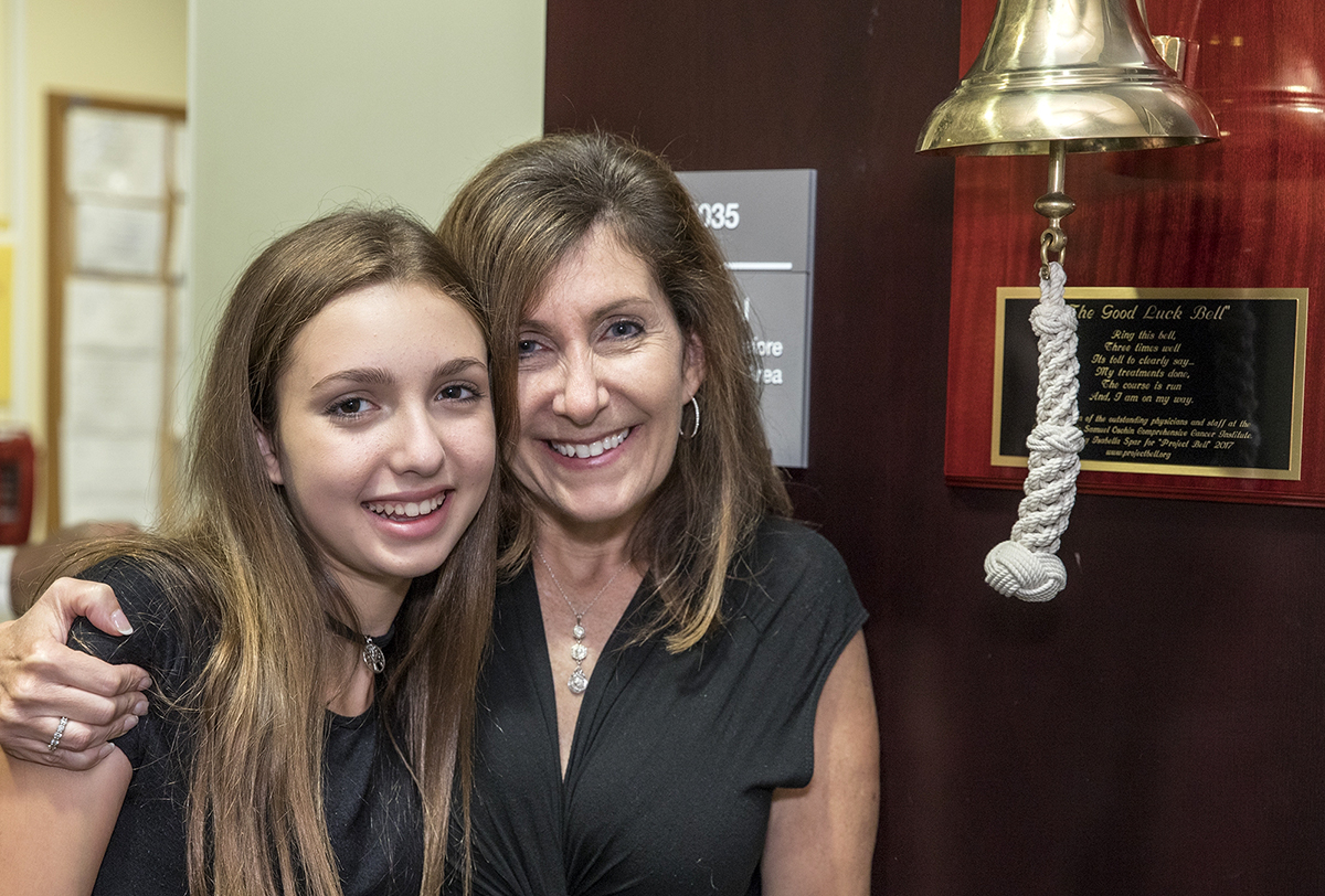Project Bell founder Isabella Spar and her mom Wendy Jeshion, with the Good Luck Bell donated to Cedars-Sinai.