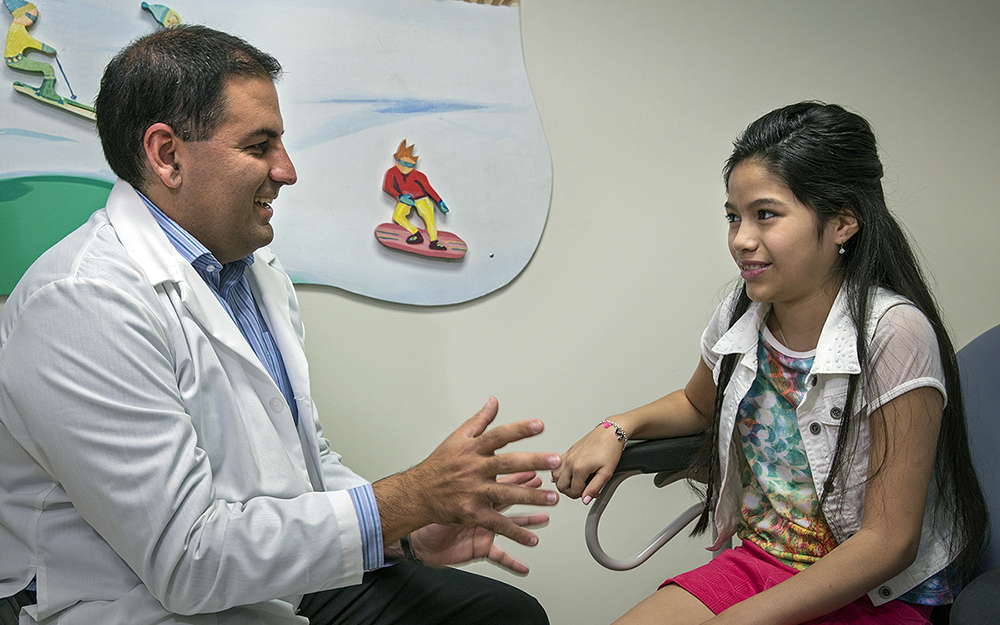 Dr. Rabizadeh talks with pediatric IDB patient Serena Melvin.