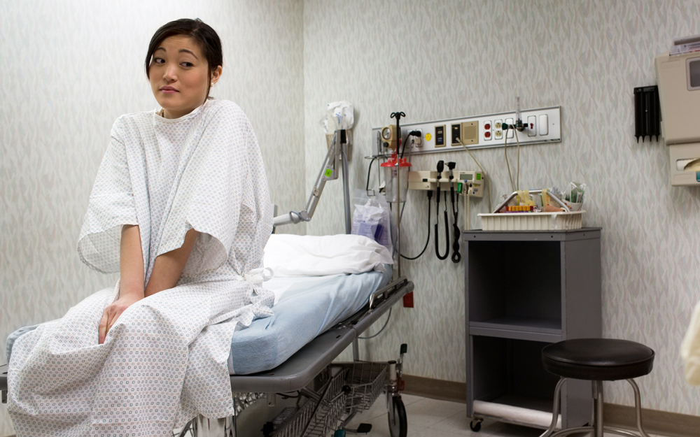 A lady waiting for her gynecologist at an OB-GYN visit