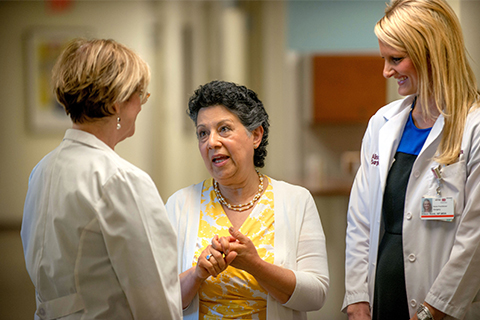 Breast cancer patient Fay Matini talking with Cedars-Sinai nurse practitioners.