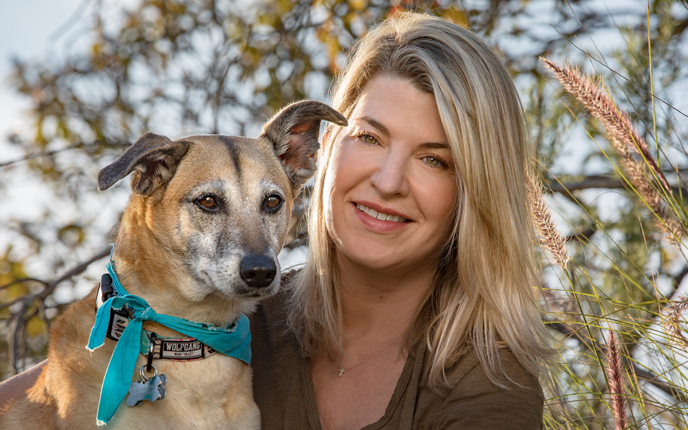 Cedars-Sinai menopause patient Andrea Hill at the park with her dog.