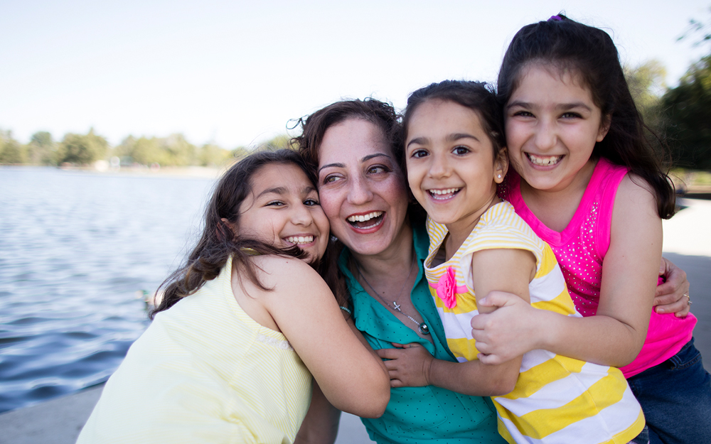 Ramela Abbamontian with her daughters after battle with breast cancer.