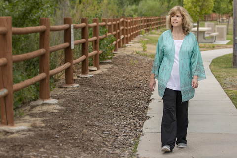 Heart transplant patient, Erika Heranic, walking in the park after her major surgery.