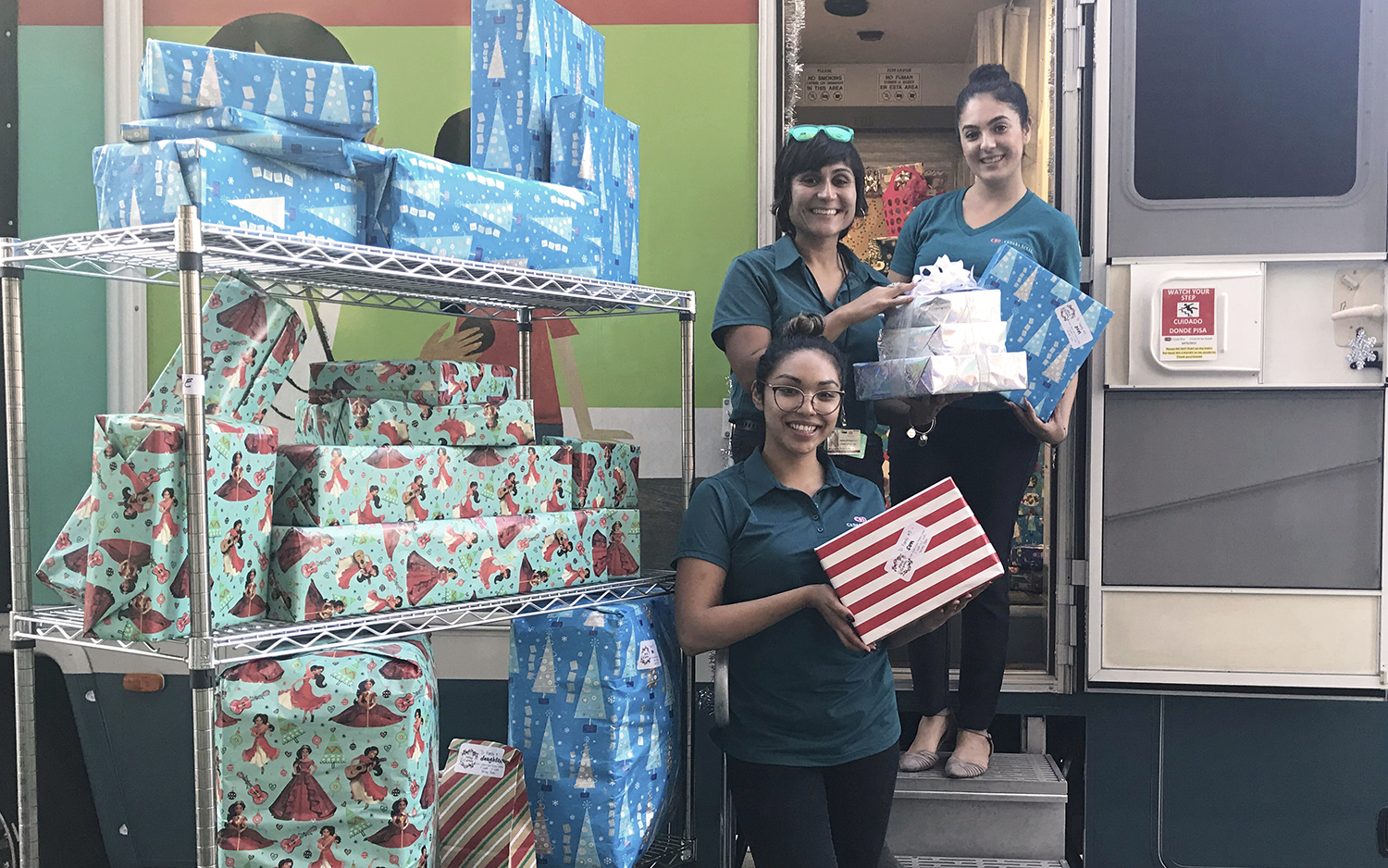 Members of the COACH team load up present for delivery before Christmas morning.