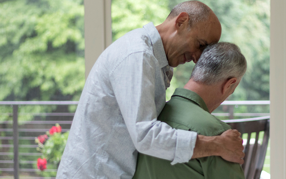 Man helping a family member.