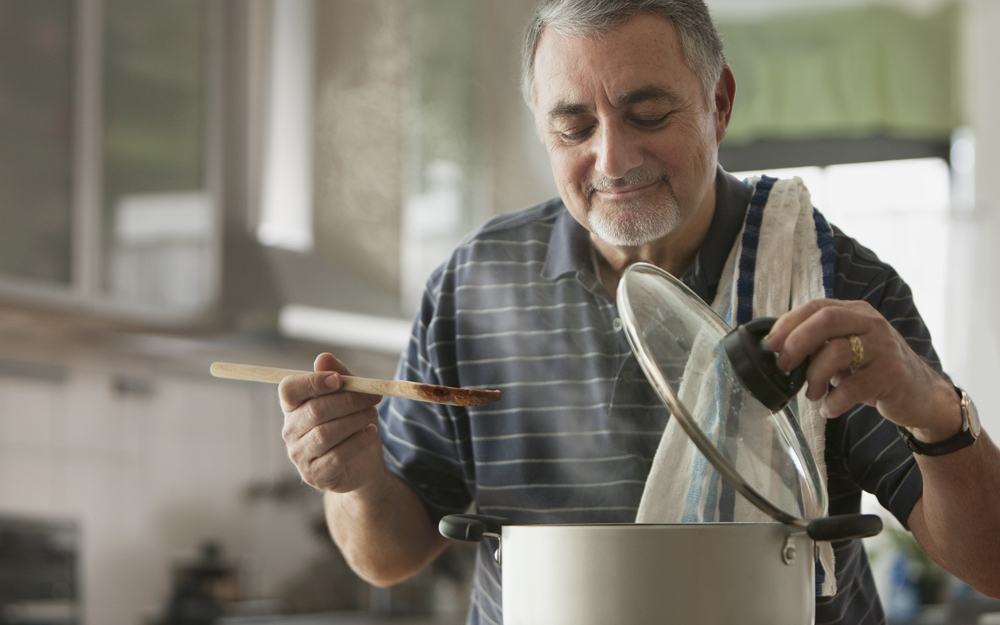 Man in the kitchen cooking.