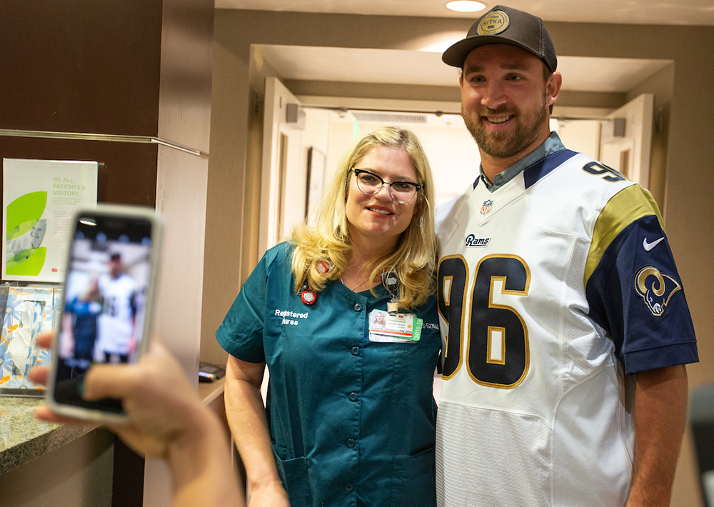 Outside linebacker #96 Matt Longacre of The Los Angeles Rams and Community Affairs visited patients of the Cedars-Sinia Infusion center at Cedars-Sinai Medical Center on Tuesday October 09, 2018, in Los Angeles, California. (Daniel Bowyer/Rams)