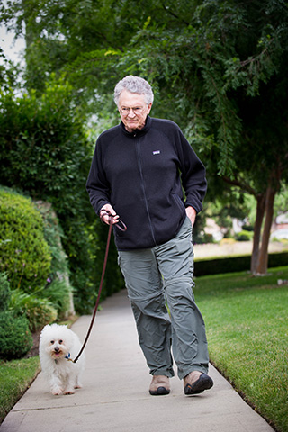 Jim Calio walking his dog, Samantha after his triple bypass surgery.