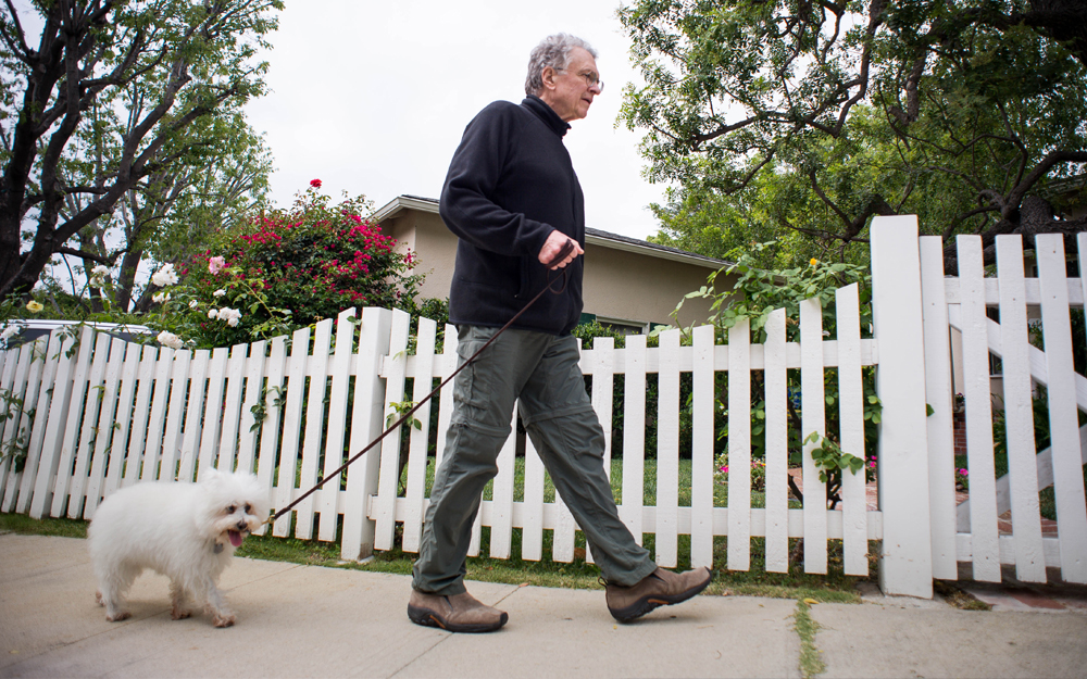 Jim Calio walking with his dog Samantha after undergoing triple bypass surgery at Cedars-Sinai.
