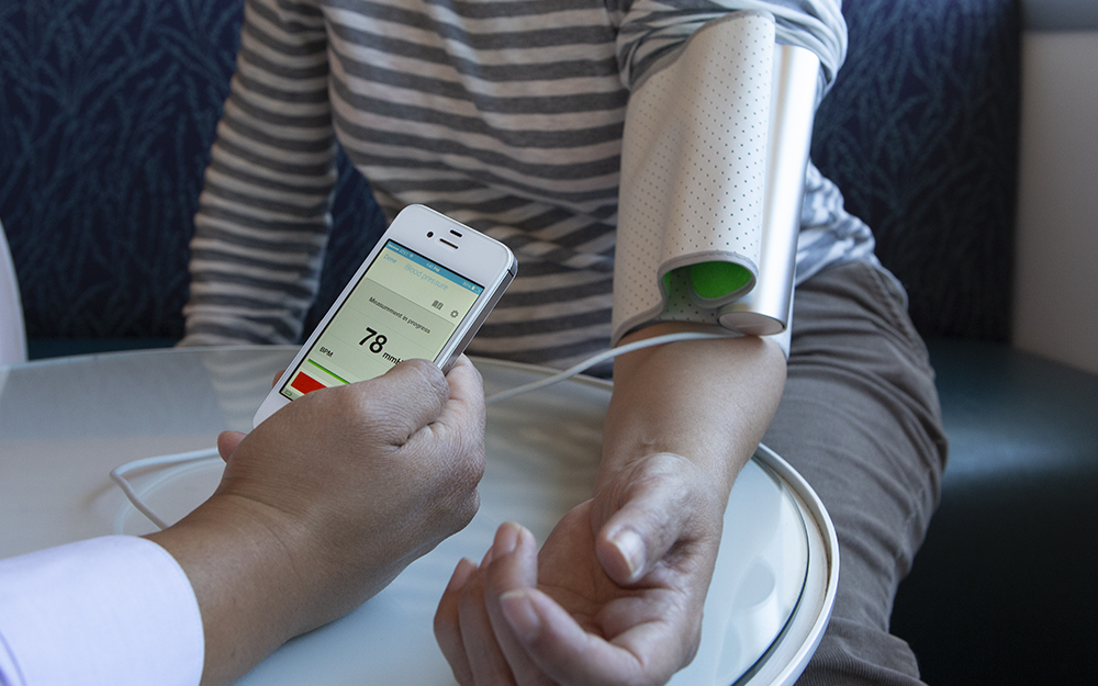 Woman getting her blood blood pressure taken.