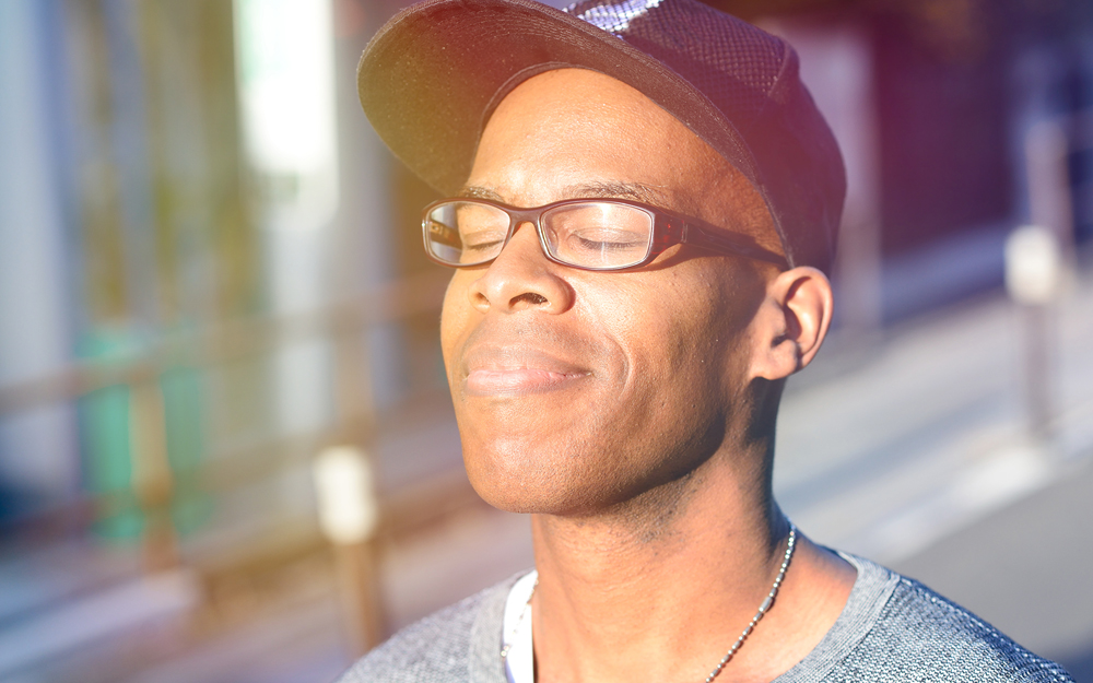 A man soaking in sunlight to get vitamin D.