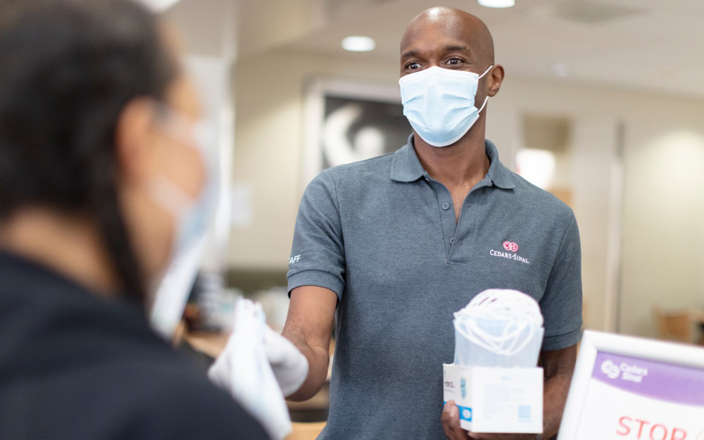 Cedars-Sinai employee Terance Imbert, working as a COVID-19 health screener