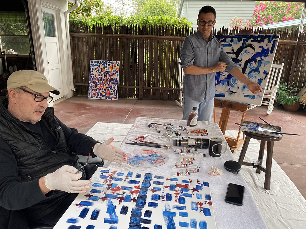 ALS patient Ken Brenner working art with artist Octavio Molina.