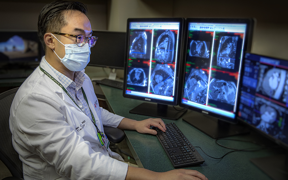 Dr. Alan Kwan, examining an MRI.