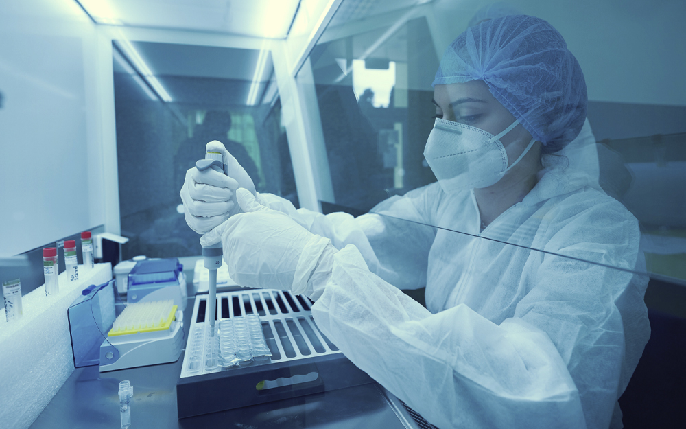 A scientist working with test tubes in a laboratory