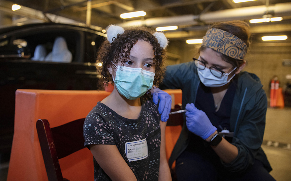 Girl getting her Covid-19 vaccine shot.