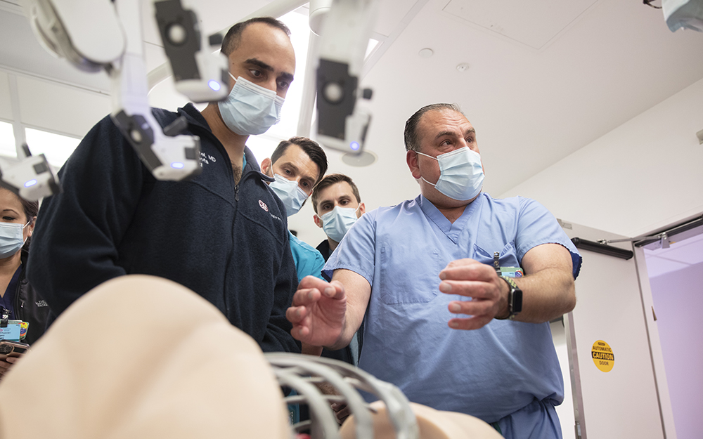 Dr. Soukiasian in room with other doctors.