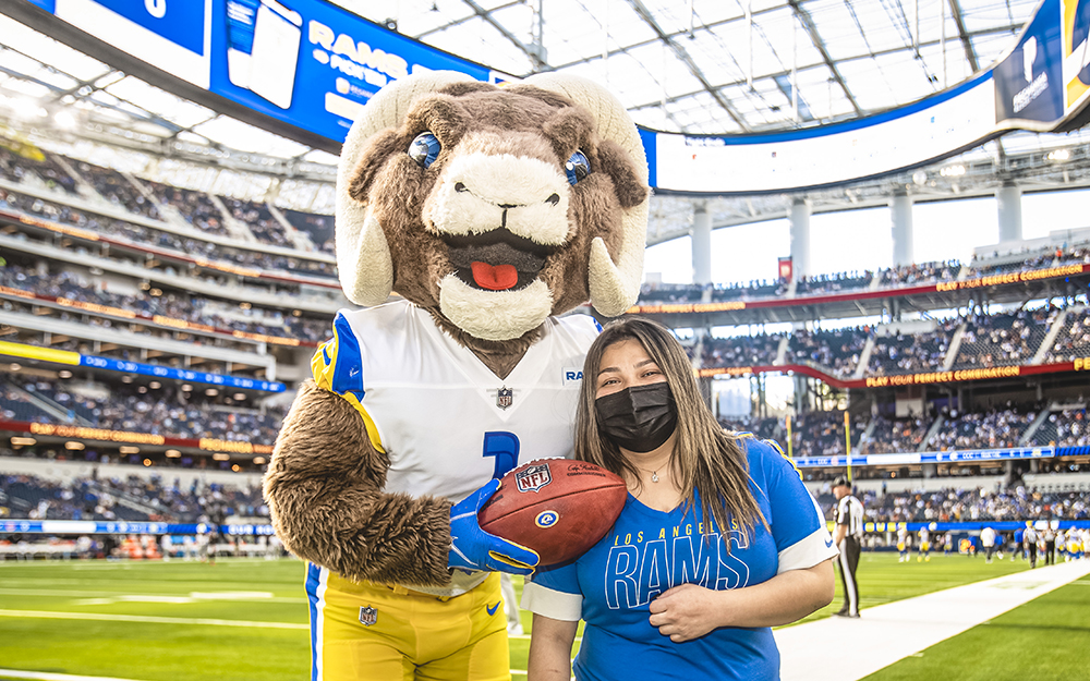 Jordan Kirkland with Rampage, the Ram's mascot.