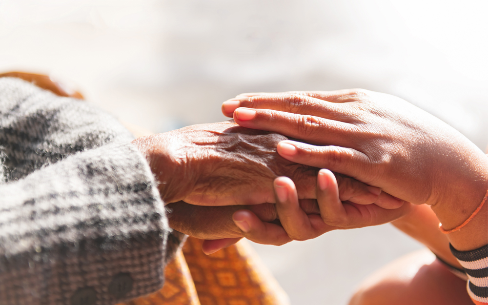 A pair of holding hands for support