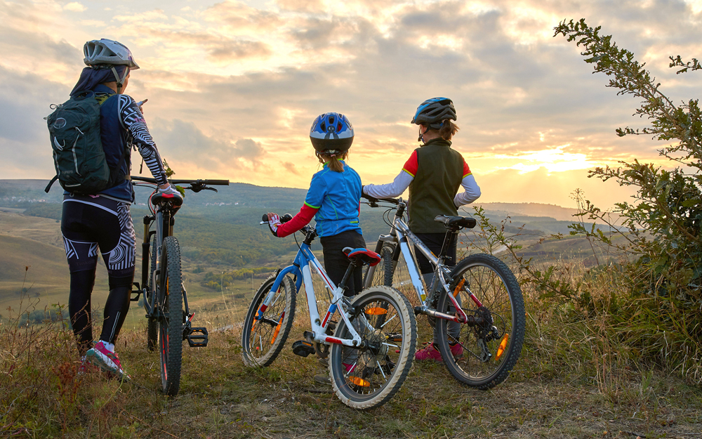 A family enjoying a healthy bike ride together.