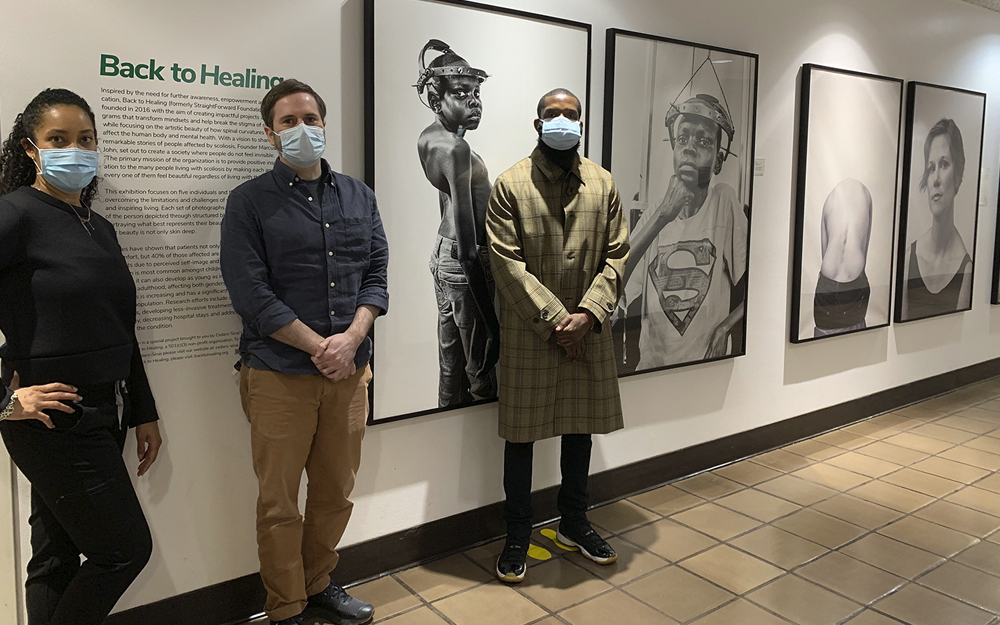 Dr. Lindsey Ross, Cedars-Sinai art curator John Lange, and artist Marcus John at the "Back to Healing" Exhibit at Cedars-Sinai