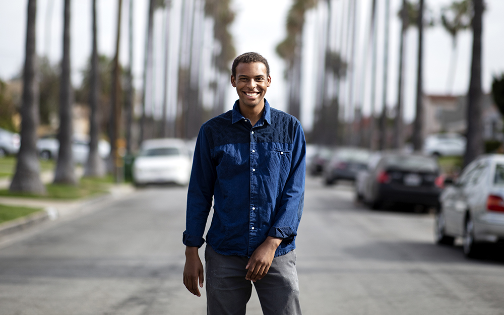 Thevi Jean-Louis standing on a California street.