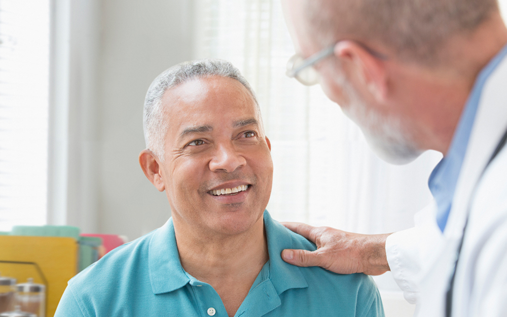 Man at doctor's office getting check up.