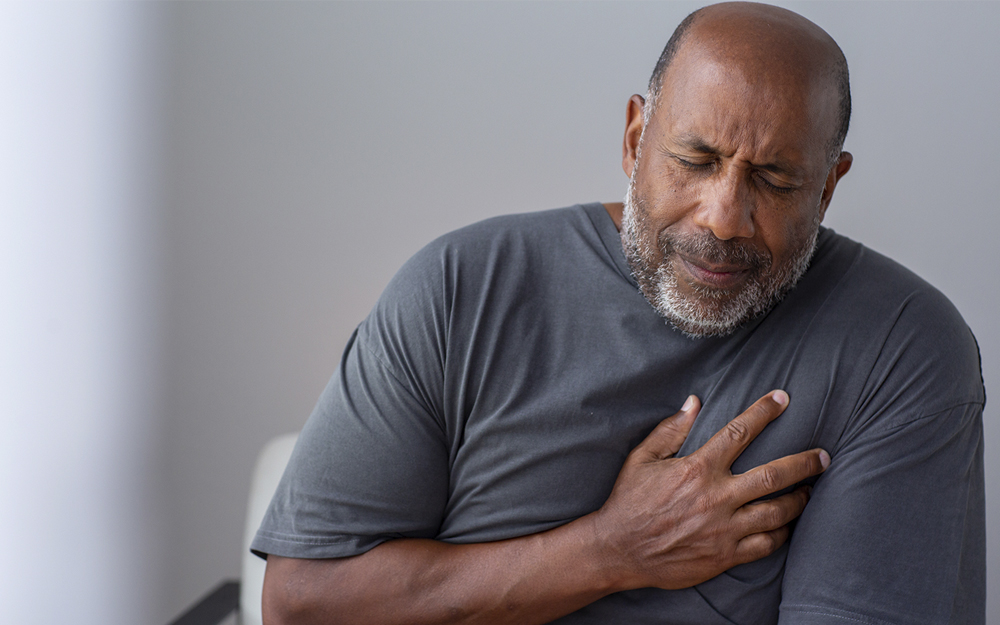 A senior man suffering from chest pains