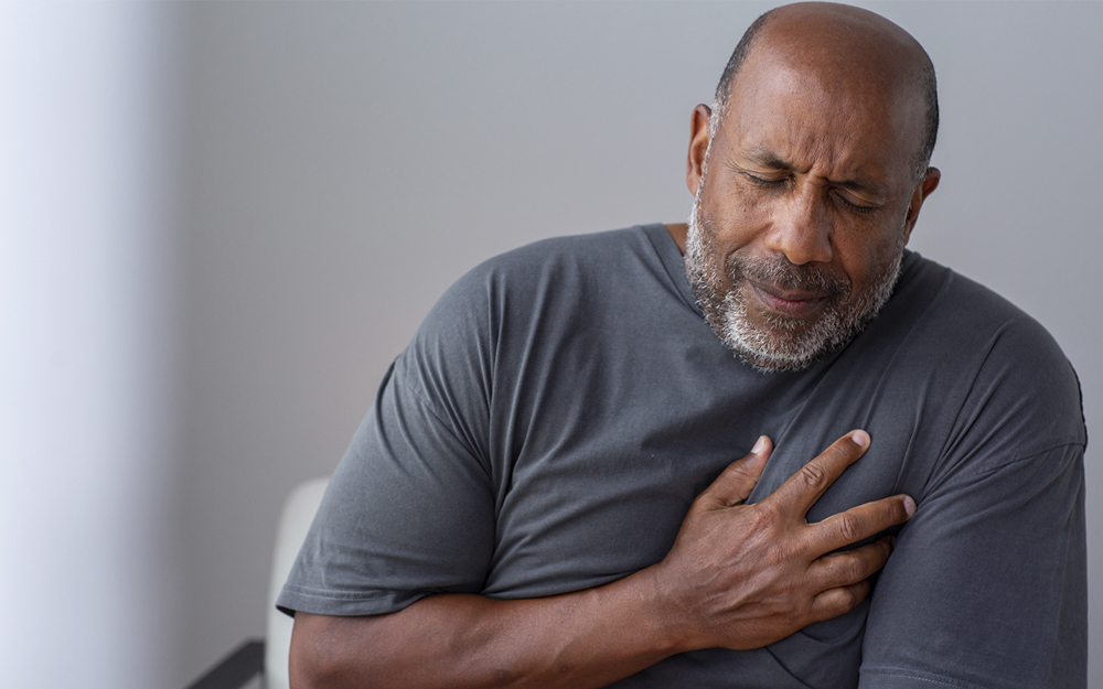 A senior man suffering from chest pains.