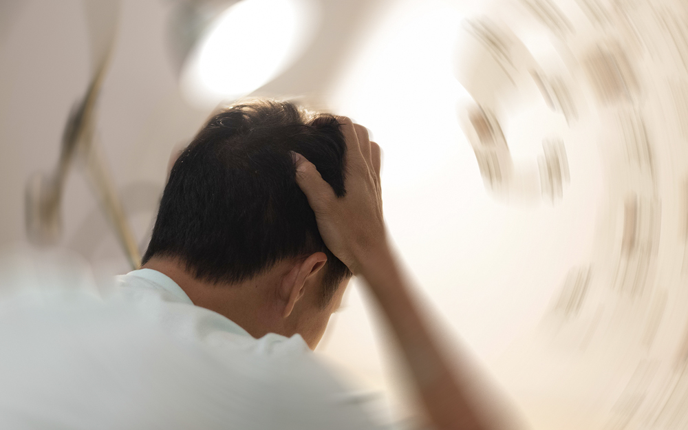 A person experiencing dizziness and confusion