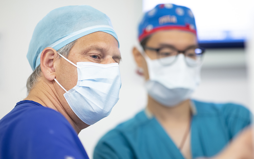 Neurosurgeons in surgery room.