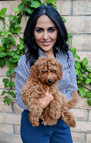 Dr. Sevini Shahbaz Hallaian, holding her puppy, Sadie.