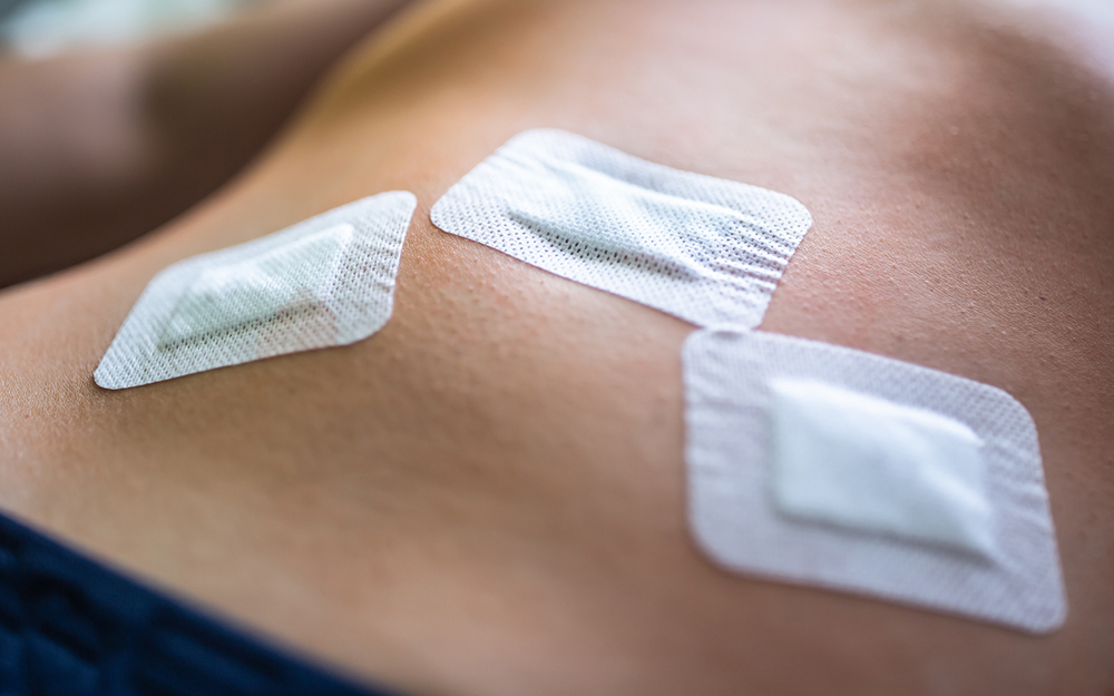 Plasters sticked on a belly after the laparoscopy.