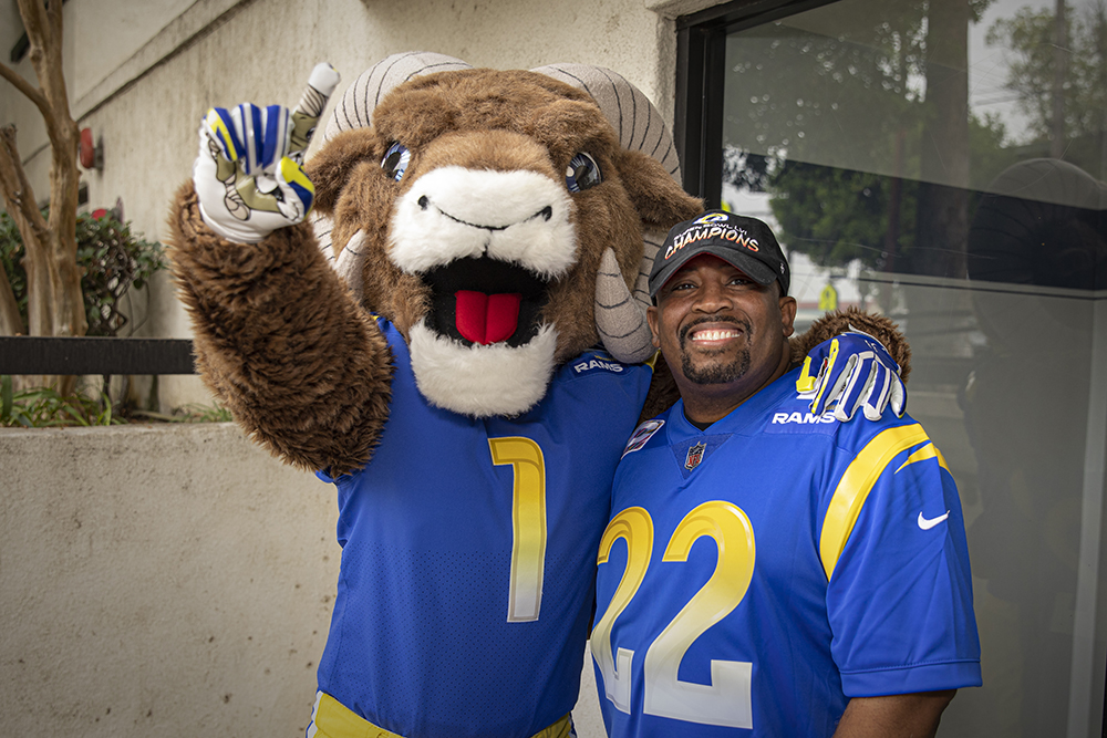 Cancer survivor James Ward with Rams mascot Rampage.