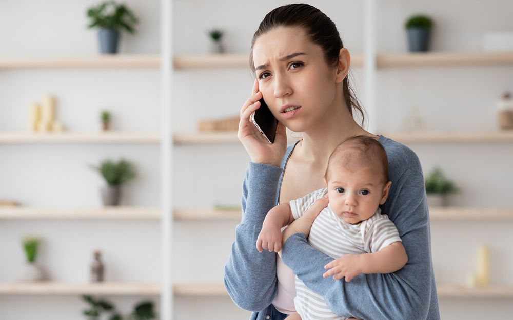 Portrait Of Worry Young Mother Holding Newborn Baby On Hands And Talking On Cellphone, Concerned Millennial Mom Calling To Doctor To Get Advice About Infant Health And Child Care, Free Space
