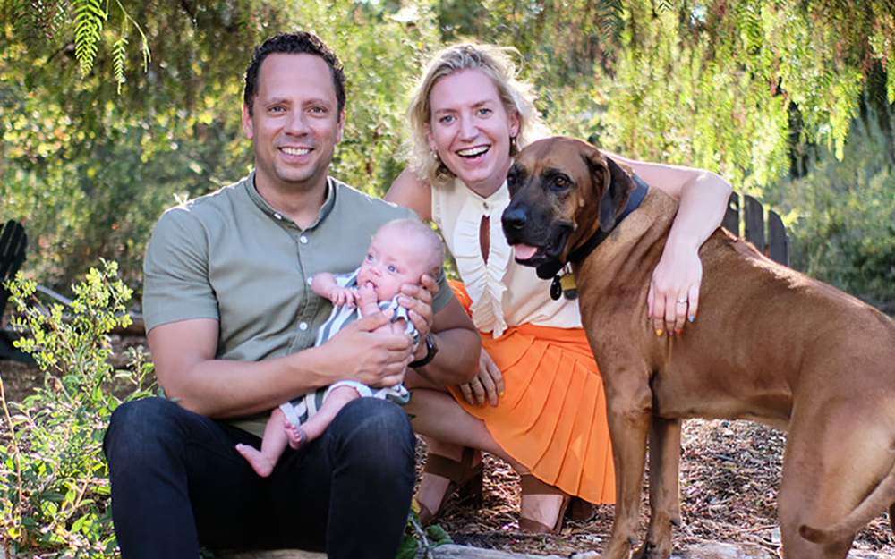 Baby Bliss, who spent 101 days in the NICU, is now thriving. Photographed here with her parents, Fransiska Weckesser and Michael Douglas, and their dog, Doog.