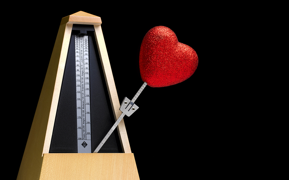 Metronome illustrating a ticking heart beat of a body's biological clock.