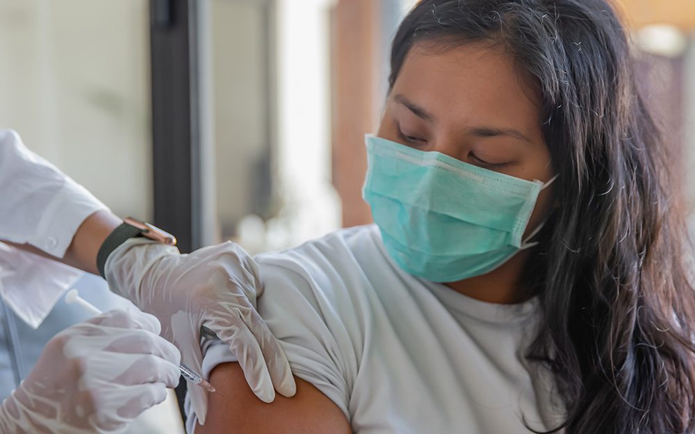 Woman getting Covid-19 vaccine shot.