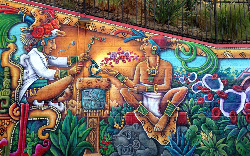 Lincoln Heights leukemia mural depicting a Mayan shaman looking at a blood sample.